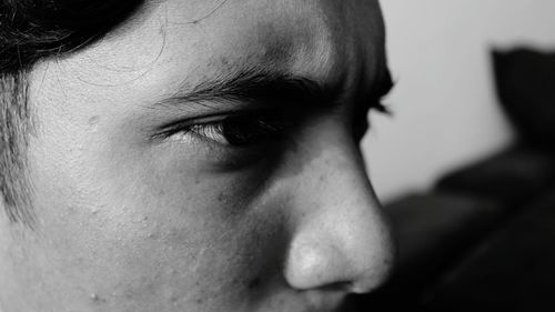 Close-up of young man looking away