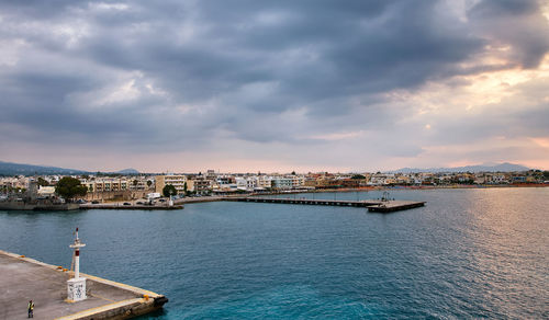 Scenic view of sea and buildings against sky