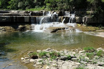 Scenic view of waterfall in forest