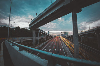 Long exposure of cars on bridge at dusk