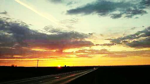 Scenic view of cloudy sky at sunset