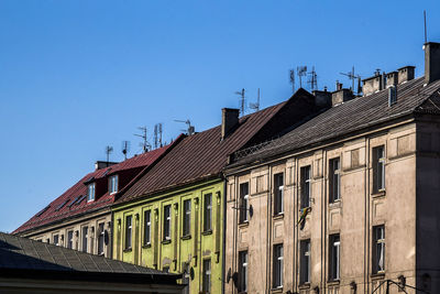 Low angle view of building against clear blue sky