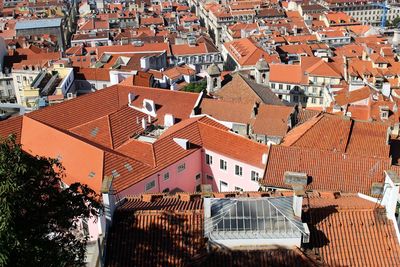 High angle view of houses in town against sky