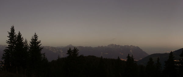 Scenic view of mountains against clear sky during sunset