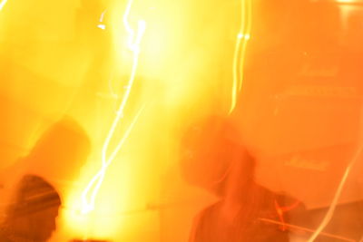 Close-up of yellow light at night