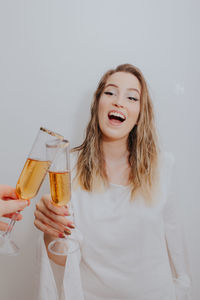 Young woman holding champagne 