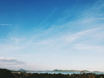 Scenic view of landscape against blue sky