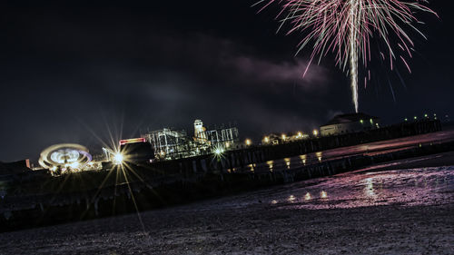 Firework display at night