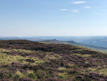 Scenic view of landscape and sea against sky