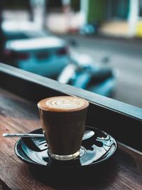 Close-up of coffee cup on table