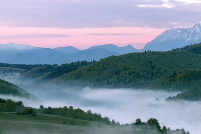 Scenic view of mountains against sky during sunset