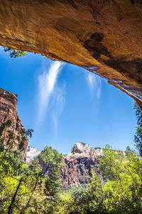 Low angle view of rock formation against sky