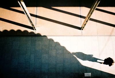 High angle view of person walking through narrow lane