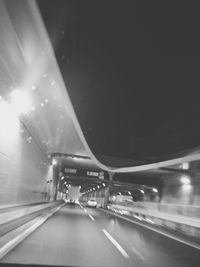 Blurred motion of car on road at night