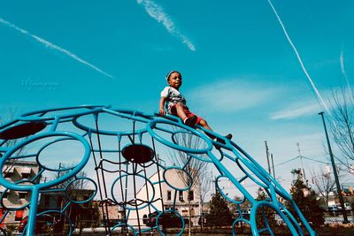 Full length of girl standing on field against sky