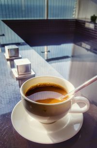 Close-up of coffee cup on table