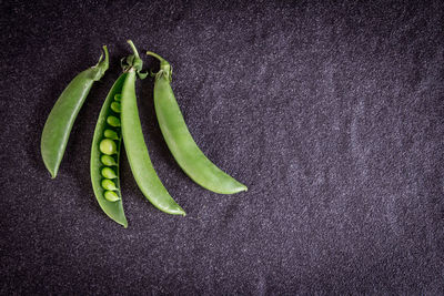 High angle view of green chili pepper against black background