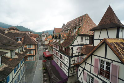 Buildings in town against sky