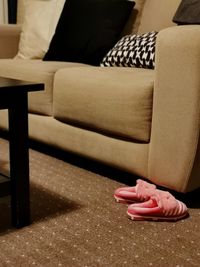 High angle view of person relaxing on sofa at home