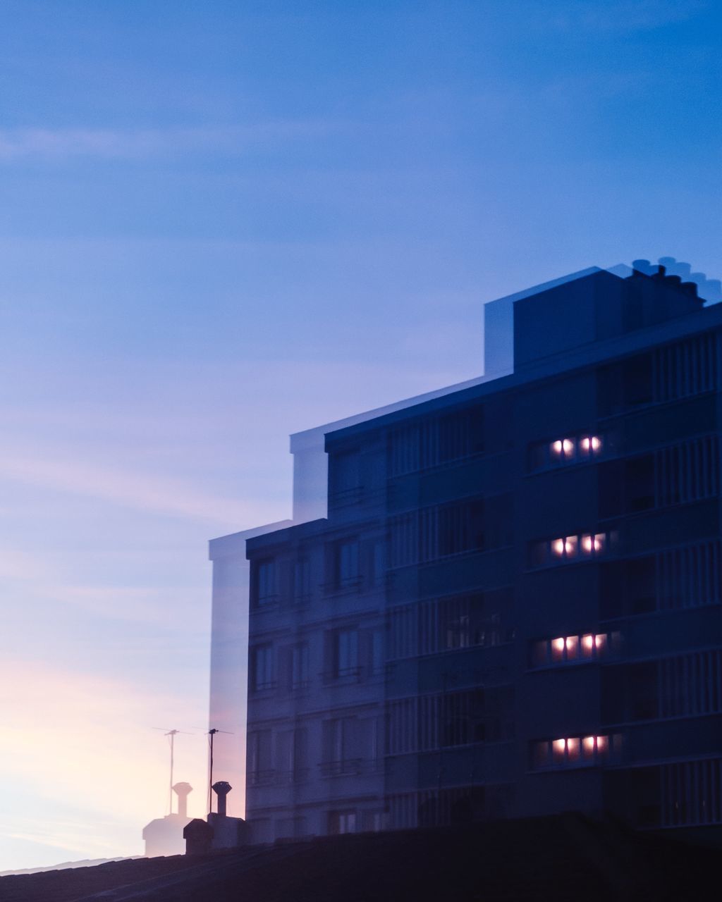 LOW ANGLE VIEW OF BUILDING AGAINST SKY