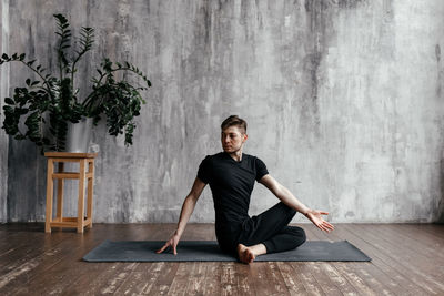 A man engaged in yoga and meditation, performing asanas