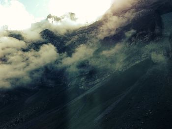 Scenic view of landscape against cloudy sky