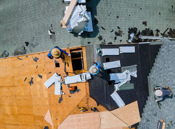 Directly above shot of people working on roof top