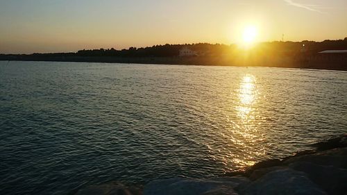 Scenic view of sea at sunset