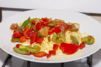 Close-up of chopped fruits in plate on table