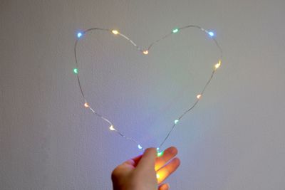 Close-up of hand holding heart shape