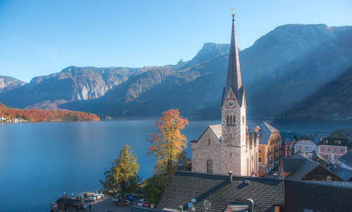 Panoramic view of buildings and mountains against sky