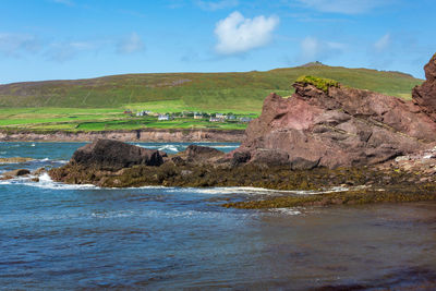 Scenic view of sea and rocks against sky