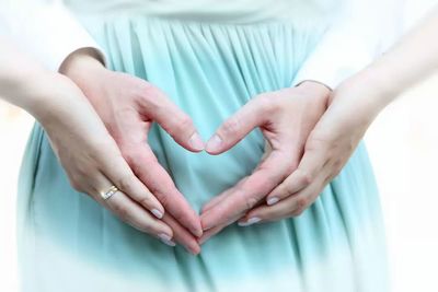 Cropped image of woman holding hands