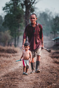 Full length of father with daughter