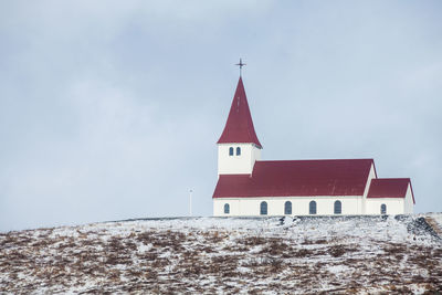 Low angle view of building against sky during winter