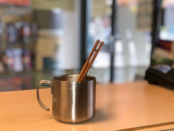 Close-up of coffee cup on table
