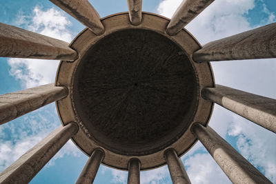 Low angle view of airplane flying against sky