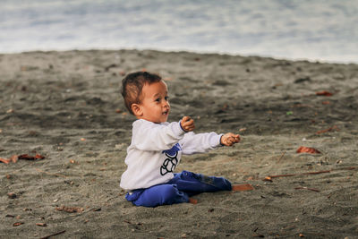 Cute boy playing with straw