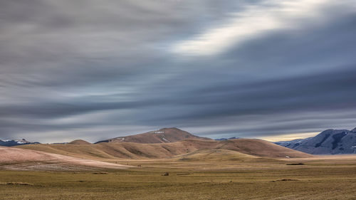 Scenic view of landscape and mountains against sky