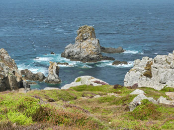 Rocks on shore by sea