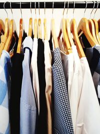 Close-up of clothes hanging on display at store