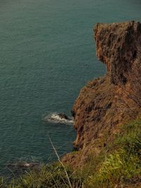 High angle view of cliff by sea