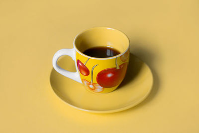 Close-up of coffee cup on table