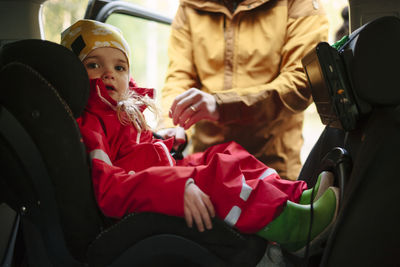 Girl sitting in car