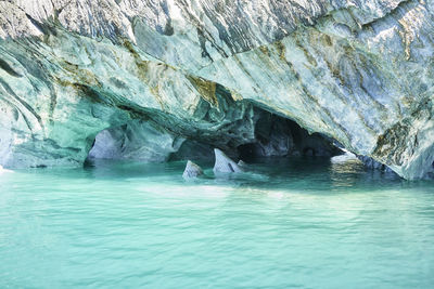 Scenic view of sea seen through cave