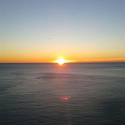 Scenic view of sea at sunset