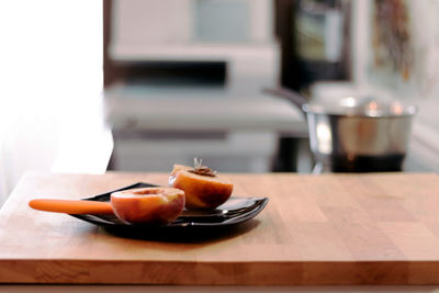 Close-up of orange juice in plate on table