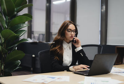 Businesswoman working on table