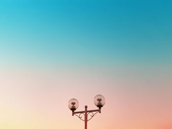 Low angle view of bird flying against clear sky