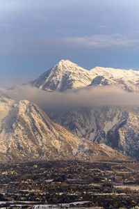 Scenic view of snowcapped mountains against sky